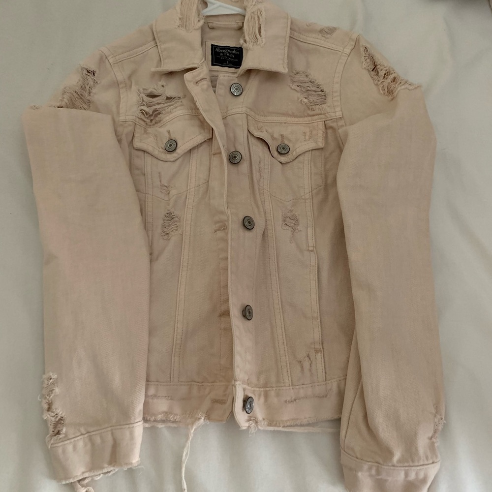 Light pink distressed denim jacket